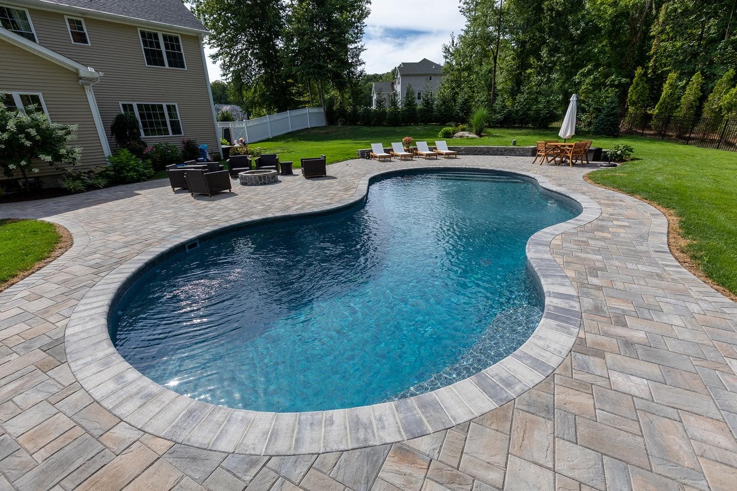 Two-person Sundance hot tub with bubbling water, showcasing family-friendly hot tubs for sale in New Fairfield, CT.