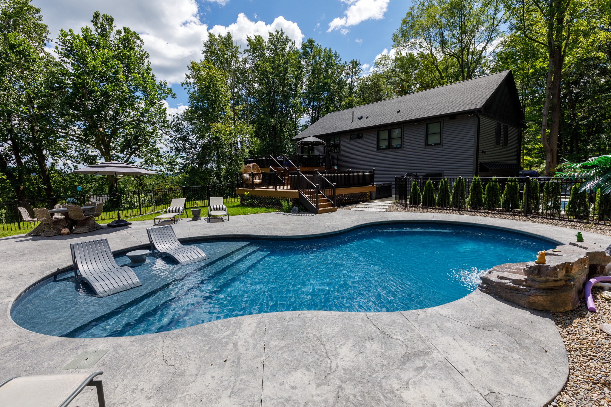 Two-person Sundance hot tub with bubbling water, showcasing family-friendly hot tubs for sale in New Fairfield, CT.